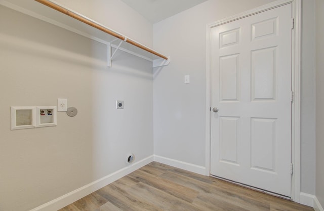 washroom featuring electric dryer hookup, light hardwood / wood-style flooring, and washer hookup