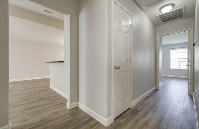 corridor featuring dark hardwood / wood-style floors