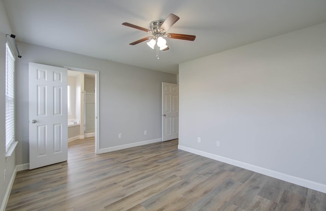 interior space with light hardwood / wood-style flooring and ceiling fan