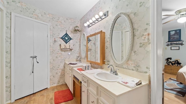 bathroom featuring hardwood / wood-style floors, ceiling fan, and vanity