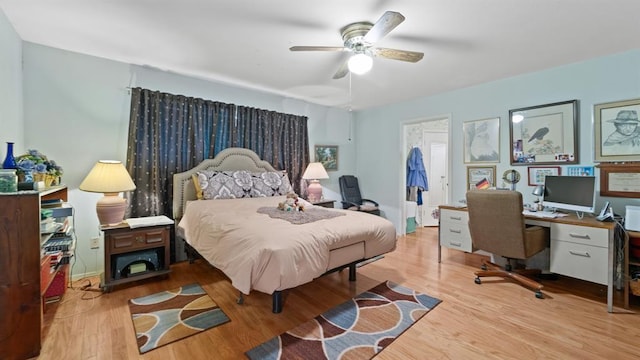 bedroom featuring ceiling fan and light hardwood / wood-style floors