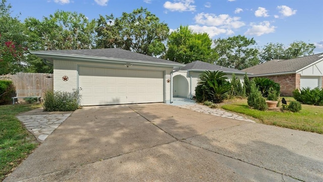 single story home with a garage