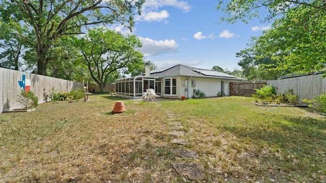 view of yard with a sunroom