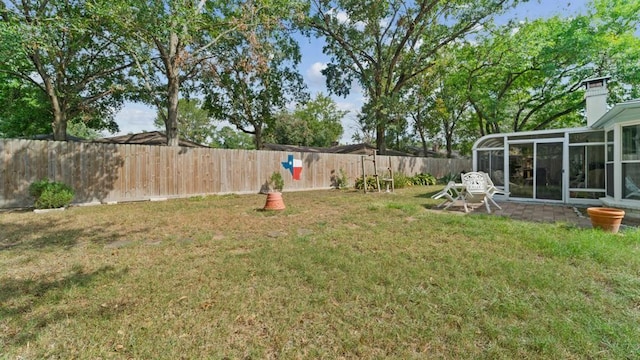 view of yard with a sunroom