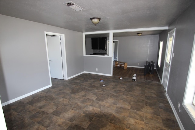 interior space featuring a textured ceiling