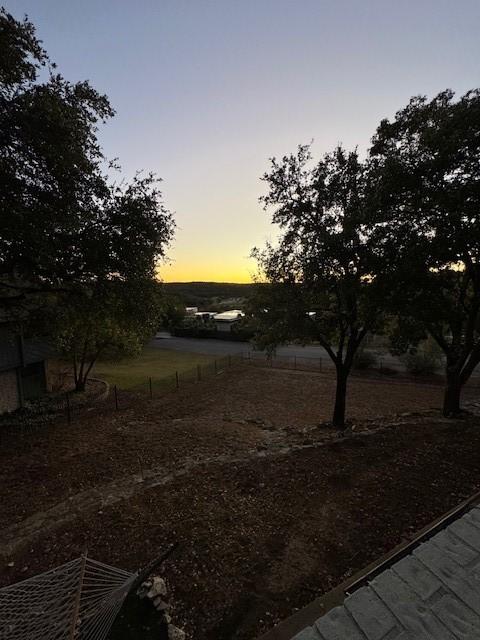 view of yard at dusk