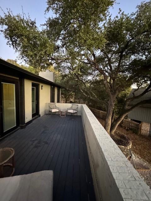 wooden terrace featuring an outdoor living space