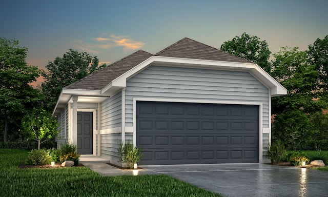 view of garage at dusk