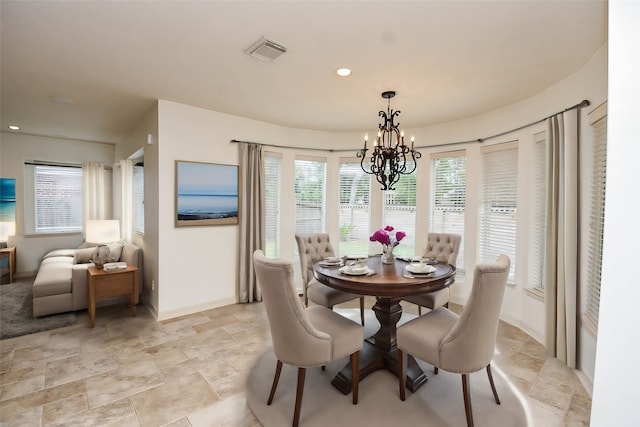 dining area with a notable chandelier