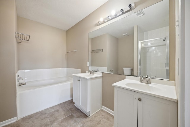 full bathroom with tile patterned flooring, vanity, toilet, and independent shower and bath