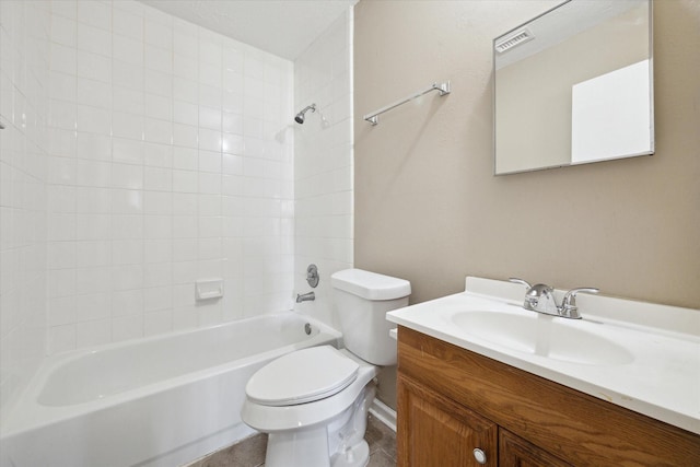 full bathroom with tile patterned flooring, vanity, tub / shower combination, and toilet