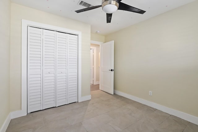 unfurnished bedroom with a closet and ceiling fan