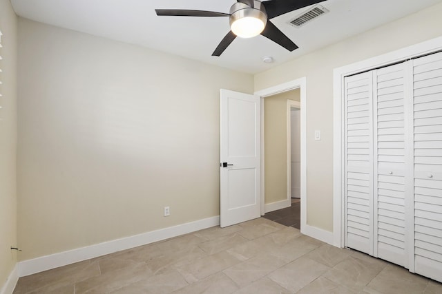 unfurnished bedroom with a closet and ceiling fan