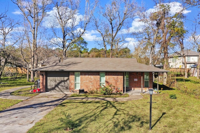 ranch-style house featuring a garage and a front lawn