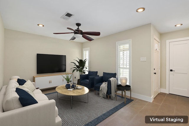 tiled living room with ceiling fan