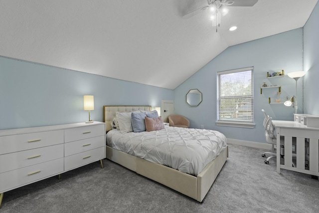 bedroom with ceiling fan, vaulted ceiling, and light colored carpet