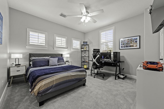 carpeted bedroom with ceiling fan