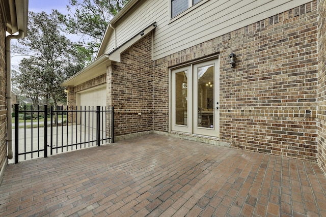 wooden terrace with a patio area