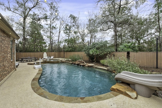 view of swimming pool featuring a patio