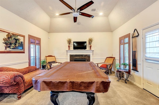 playroom with light carpet, vaulted ceiling, ceiling fan, billiards, and a premium fireplace