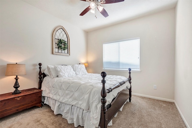 bedroom featuring light colored carpet and ceiling fan