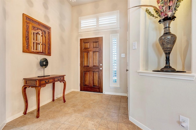 entryway featuring light tile patterned floors