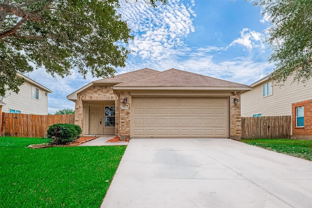 view of front of house with a garage and a front lawn