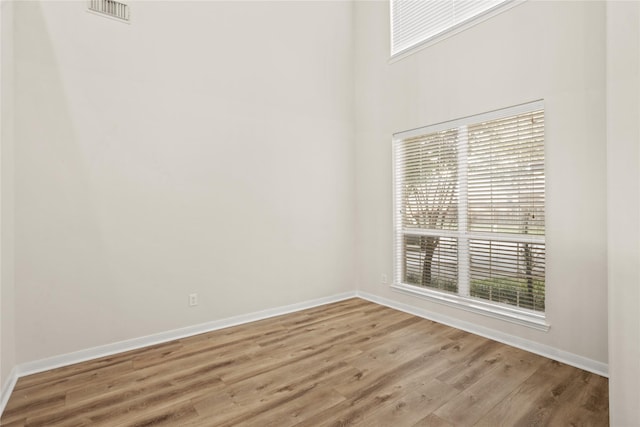 unfurnished room with light hardwood / wood-style floors