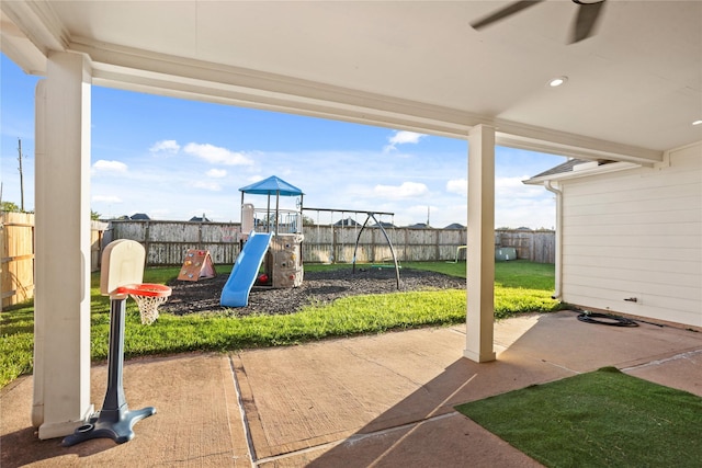 view of patio / terrace featuring ceiling fan and a playground