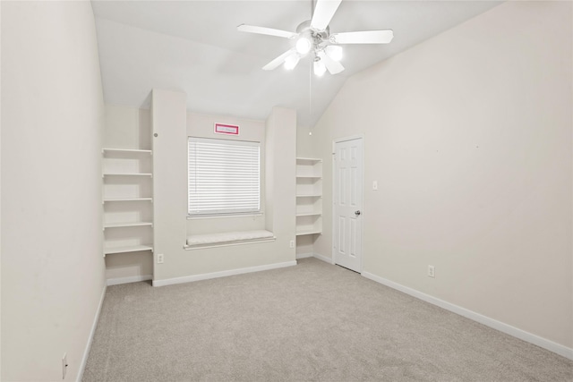 interior space featuring light carpet, ceiling fan, and lofted ceiling