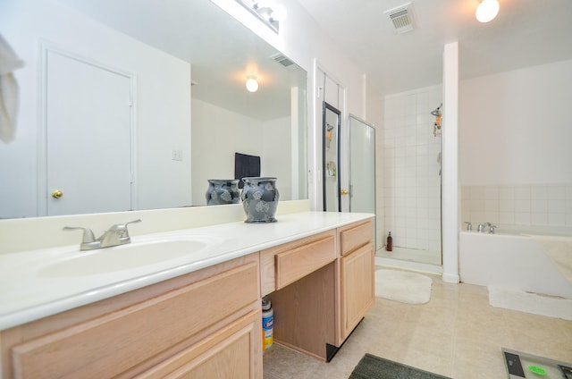 bathroom with tile patterned floors, vanity, and independent shower and bath