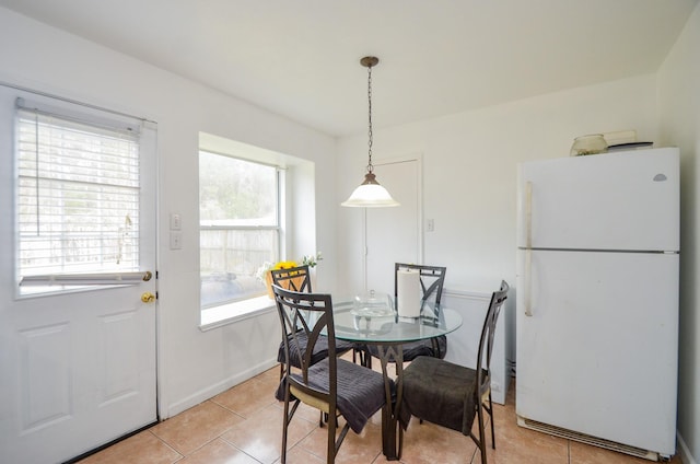 dining room featuring light tile patterned floors