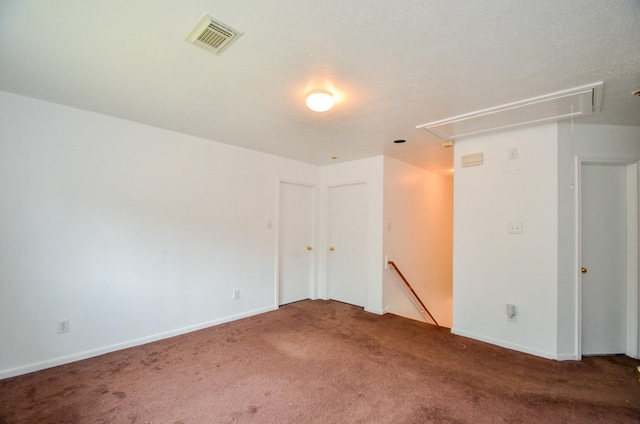 spare room featuring carpet floors