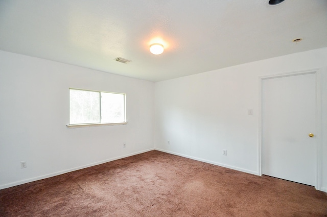 empty room with carpet flooring