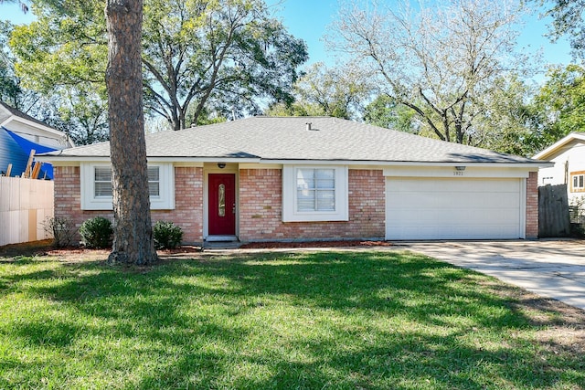 ranch-style house featuring a front lawn, brick siding, driveway, and an attached garage