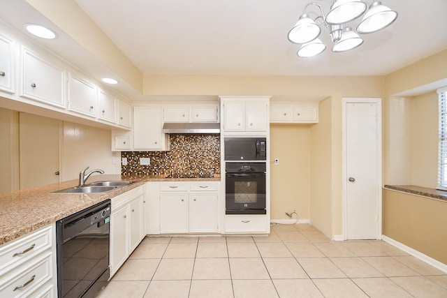 kitchen featuring white cabinets, backsplash, under cabinet range hood, black appliances, and a sink