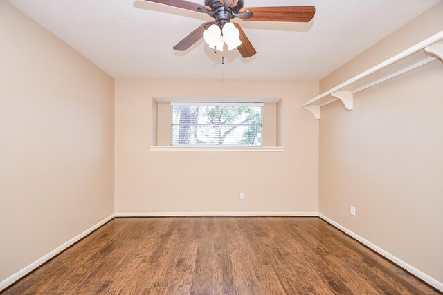 unfurnished room featuring ceiling fan, baseboards, and wood finished floors