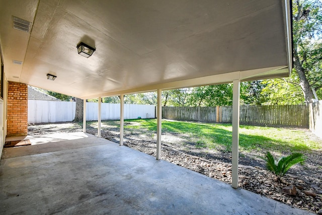 view of patio with a fenced backyard and visible vents