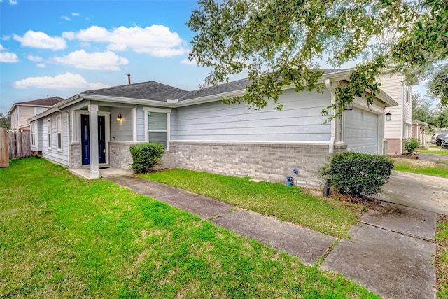 view of front of house with a front yard and a garage