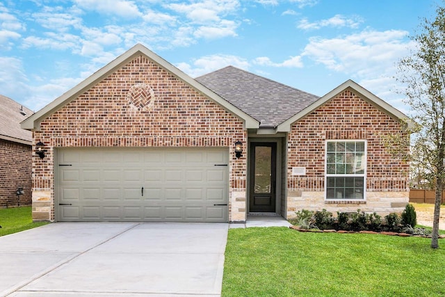 view of front of home with a front yard and a garage