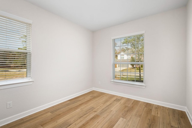 empty room with light hardwood / wood-style floors