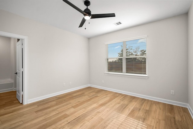 empty room with light wood-type flooring and ceiling fan