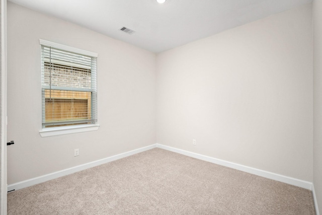 empty room featuring carpet flooring