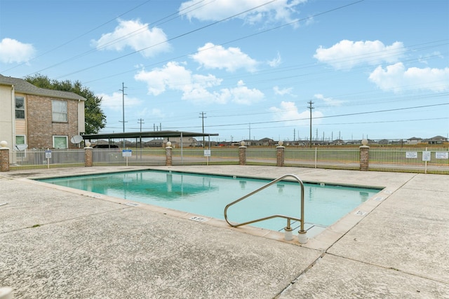 view of swimming pool featuring a patio area