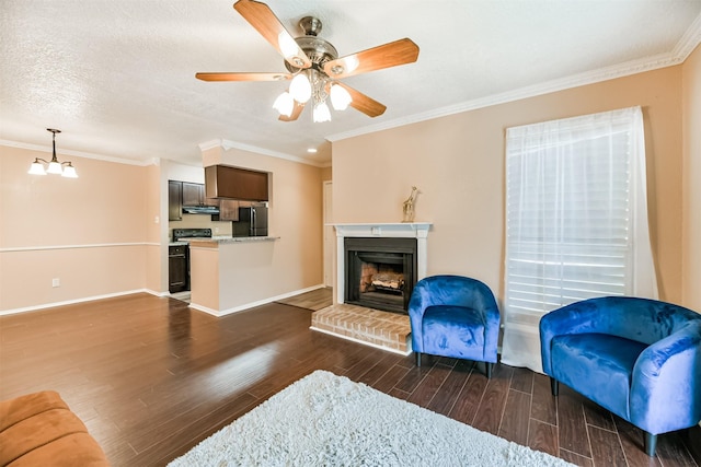 living room featuring a textured ceiling, ceiling fan with notable chandelier, dark hardwood / wood-style flooring, and crown molding