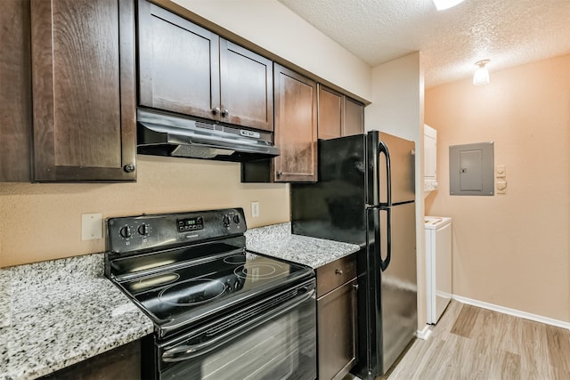 kitchen with electric panel, light stone countertops, dark brown cabinets, and black appliances