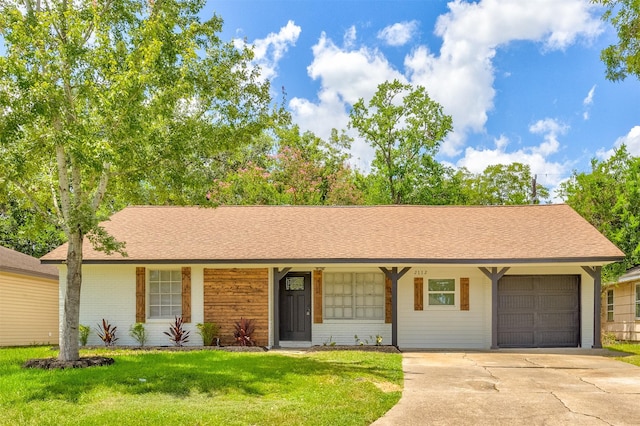 single story home featuring a front lawn and a garage