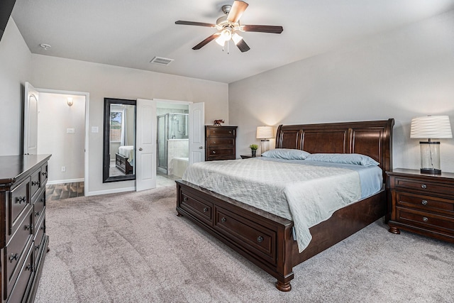 carpeted bedroom featuring ceiling fan and ensuite bathroom