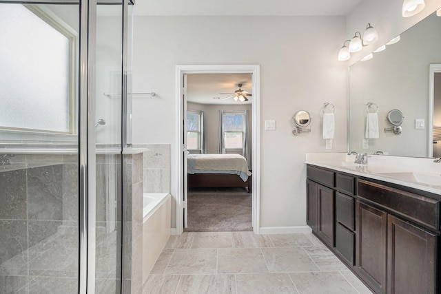 bathroom featuring ceiling fan, vanity, and shower with separate bathtub