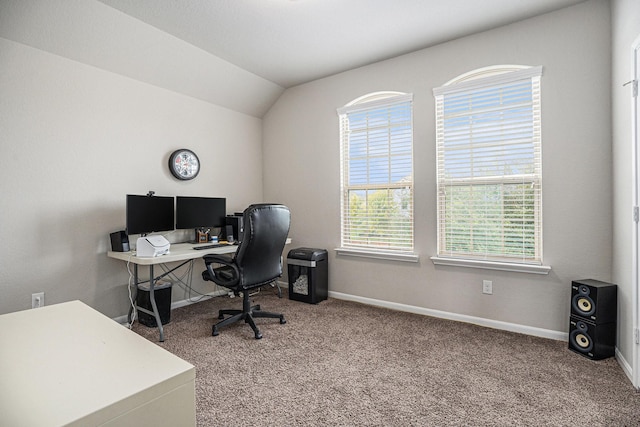 office with carpet flooring and vaulted ceiling